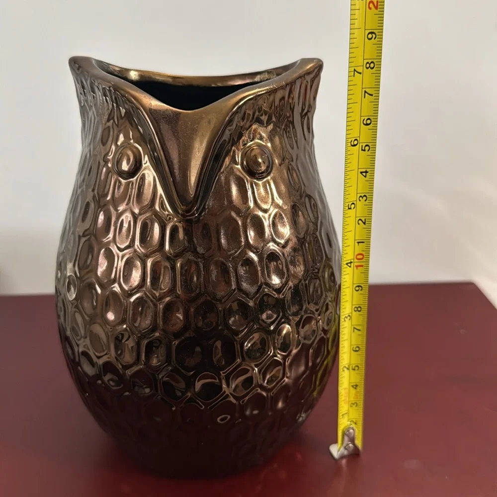 Copper/Bronze colored ceramic owl vase with a dimpled, metallic finish